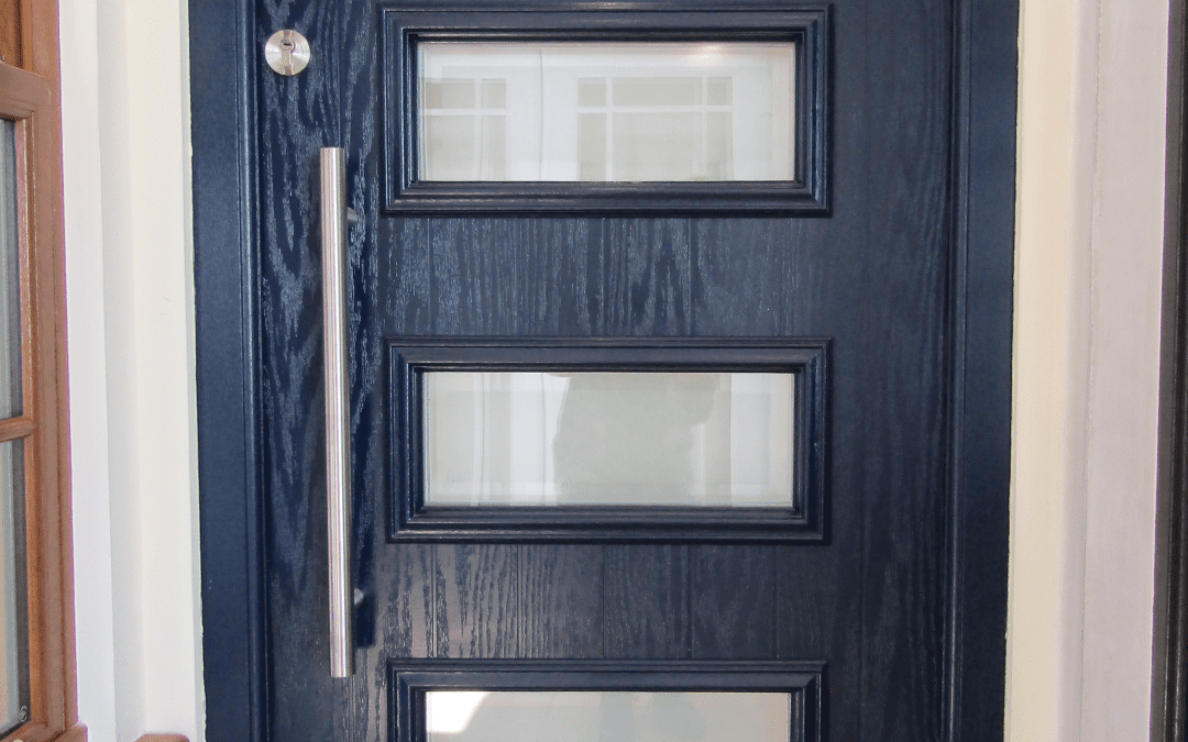 black wooden door with four small rectangular glass windows